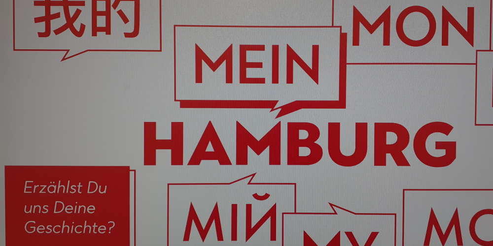 Mein Hamburg steht in roter Schrift auf weißem Hintergrund, wobei das Wort